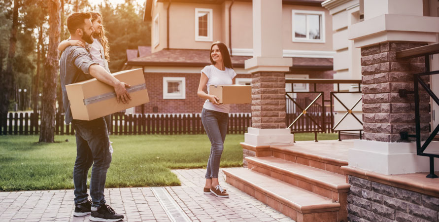 happy couple moving into a build to rent home